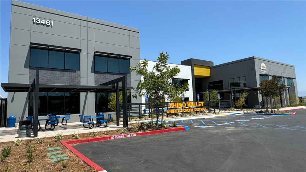  Exterior photo of the CVUSD new district office that shows the front of the building and walkway.